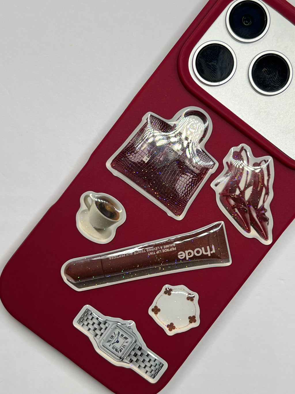 Phone case with decorative stickers on a white background